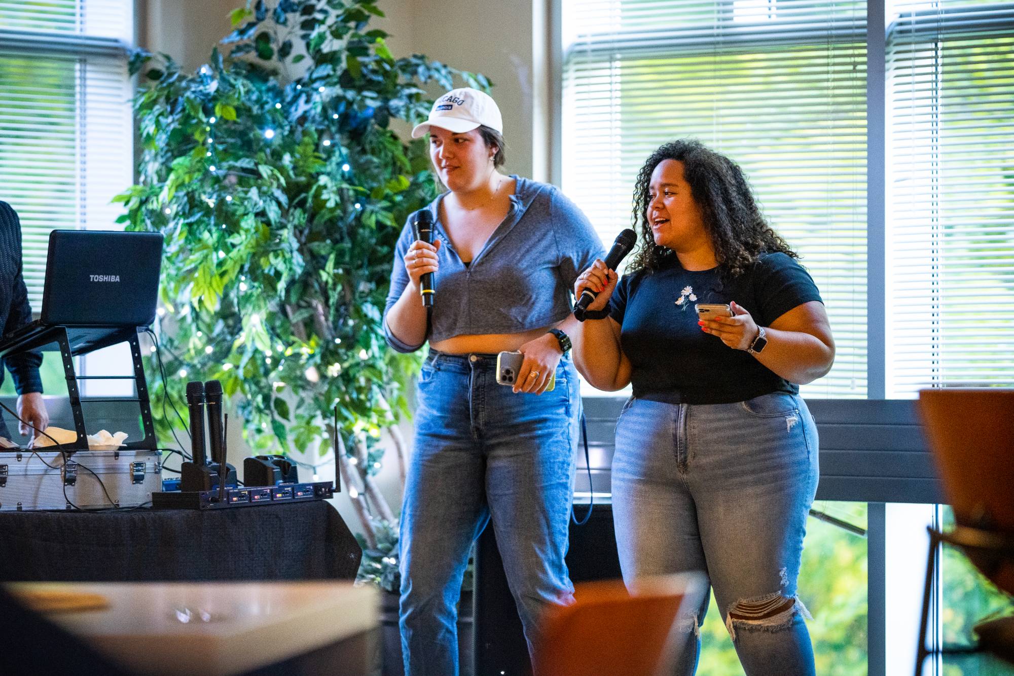 Two students singing karaoke
